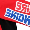 A highly customised sweatshirt in red and black featuring a logo on the sleeve.