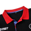 A polo shirt featuring a red collar and black body, with a colourful inner lining and a logo.