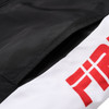 A black and white puffer jacket featuring a branded logo on the side.