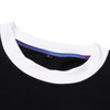 A black T-shirt featuring a white collar and a colourful inner neckline, with a small label visible.