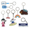 A variety of custom shape acrylic keyrings in vibrant colours, featuring unique designs and a logo on one.