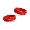 Two red silicone wristbands with textured bubble sections, one featuring a logo and the other plain.