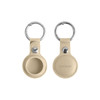 A beige PU leather AirTag holder with a keyring, featuring a circular design and a small metal snap button.