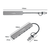 A silver 7 in 1 USB hub with multiple ports, featuring a connector cable. It has a logo and dimensions indicated.