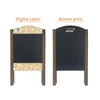 A-frame chalkboards featuring a black writing surface and decorative borders in brown wood. One side has digital design, the other screen print.