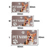 A pet feeding mat in brown featuring a dog design and paw prints, available in three sizes: S, M, and L.