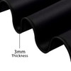 A close-up of a black rubber desk mat, highlighting its 3mm thickness and smooth texture.