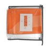 An orange medium table runner packed in a clear bag with a grey zipper. It includes a product information card.