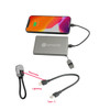 A silver aluminium power bank with a detachable cable and a phone displaying a charging icon.