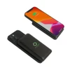 A black magnetic power bank with a logo, paired with a smartphone displaying a colourful screen.