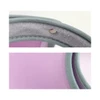 A green visor hat with a light purple interior and visible stitching details. It has a logo on the side.