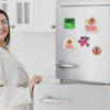 A fridge covered with colourful acrylic magnets depicting various designs, alongside a person interacting with the fridge.