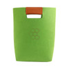 A green felt tote bag with a brown leather handle and a logo on the front.