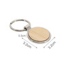 A round wooden keyring with a silver metal ring, featuring a natural wood surface. Dimensions are 3.2 cm by 0.3 cm.
