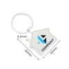 A silver house-shaped metal keyring with a circular attachment and a logo. Dimensions are 42mm by 42mm.