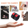 A foldable shopping shoulder bag in navy and red, compactly rolled and easily held in a hand. It includes a branding logo.