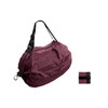 A foldable shopping shoulder bag in a rich burgundy colour, with black straps and a small folded version beside it.