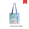 A PVC waterproof tote bag with an iridescent finish and blue screen-printed straps. It features a logo on the straps.