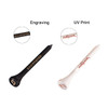 Two bamboo golf tees in black and white, featuring different designs and a logo on each.