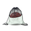 A drawstring mesh backpack in white with a black top, holding a basketball inside. It has a logo.