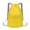 A yellow bucket drawstring backpack with grey straps and a front pocket. Features a simple, minimalist design.