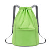 A green bucket drawstring backpack with adjustable grey straps and a front pocket. It features a simple, modern design.