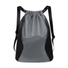 A grey and black sports drawstring backpack with mesh sides and a zippered pocket. It has adjustable straps.