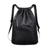 A black sports drawstring backpack with mesh sides and a sleek design, featuring adjustable straps and a logo.