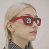 Red pinhole sticker sunglasses with a perforated design, featuring the numbers "20" and "14" on the lenses.