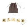 A set of cream-coloured letter tiles spelling "HELLO" with a brown drawstring pouch for storage.
