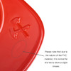 A red PVC fire chief hat with a slight crease visible on the surface. It has a logo on the side.