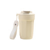 A drink bottle in cream colour with a double wall design, stainless steel, and a strap for easy carrying.
