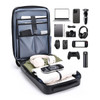 An expandable hardshell backpack in dark blue with compartments for tech items, clothing, and accessories.