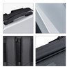 A grey expandable hardshell backpack features a sturdy handle, padded straps, and textured surfaces. It has a logo as well.
