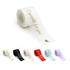 A roll of organza ribbon in various colours, including white, black, pink, red, and lavender, featuring a heart design.