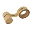 A roll of self-adhesive kraft paper tape in a natural brown colour featuring a logo and text design.