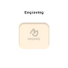 A cream-coloured product with a rounded shape features a logo and an engraving area on its surface.