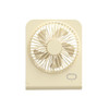 A mini desk fan in cream colour features a circular grille and a single button for operation.