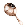 A cocktail strainer in a shiny rose gold colour with a long handle and multiple perforations. It features a logo.