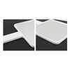 A handheld square mirror with a white frame, shown from two angles on a dark background.