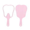 A tooth-shaped face mirror in pink with a handle, featuring a reflective surface on one side.
