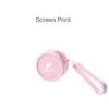 A round pink silicone coin pouch with a zipper and a wrist strap, featuring a logo.
