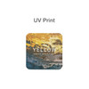 A square frosted metal coaster in yellow and earthy tones features a design with textured colours and a logo.