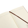 A colour changing PU leather notebook with lined pages and a brown ribbon bookmark. It has a subtle logo.