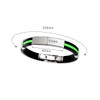 A silicone bracelet featuring a black band with a vibrant green accent, showcasing a sleek silver clasp.