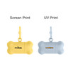 A bone-shaped pet waste bag dispenser in yellow and blue, featuring a clip and branding on each.