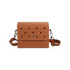 An orange briefcase with a perforated front design, featuring a shoulder strap and a metal clasp.