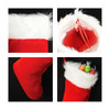 A red and white embroidered Christmas stocking with a fluffy trim and bright interior, featuring sweets inside.