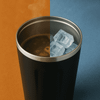 A stainless steel coffee mug featuring hot coffee on one side and ice cubes on the other, with a matte black finish.
