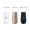 Three vacuum champagne flutes in white, gold, and black, each featuring a logo or branding.